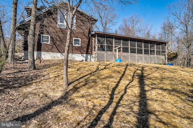 rear view of house with a sunroom