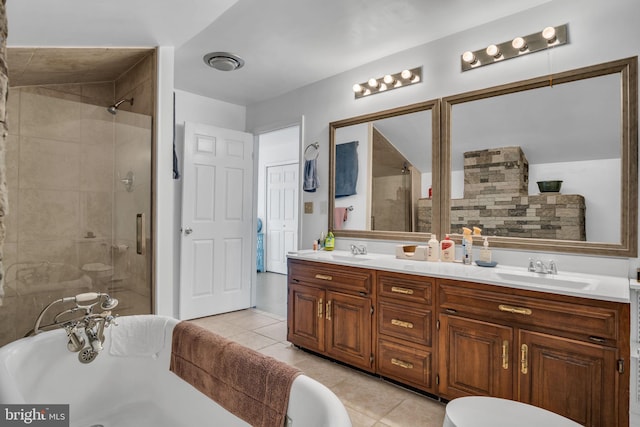 full bathroom featuring a shower stall, a washtub, and a sink