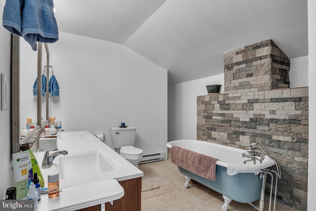 bathroom featuring vanity, lofted ceiling, a freestanding bath, a baseboard heating unit, and toilet