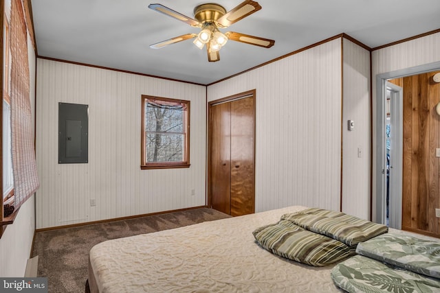 carpeted bedroom with electric panel, ceiling fan, baseboards, and ornamental molding