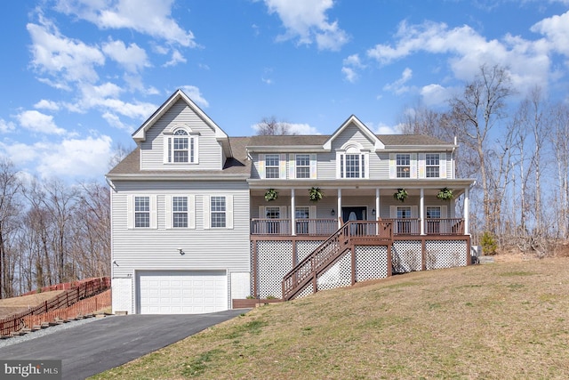 view of front of home featuring aphalt driveway, a porch, stairway, a front yard, and an attached garage