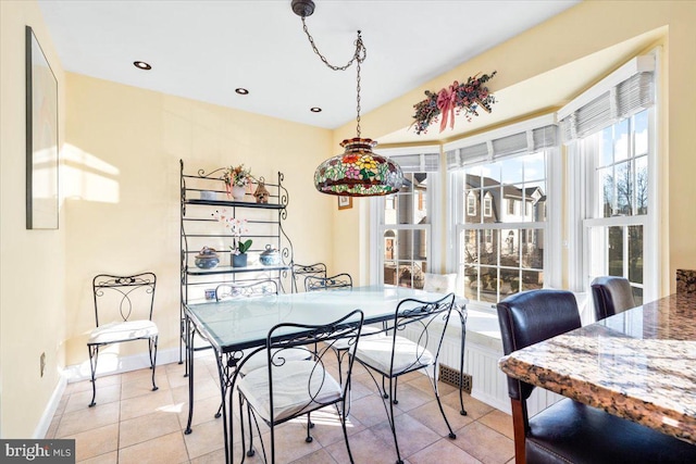 dining area with light tile patterned floors, recessed lighting, and baseboards