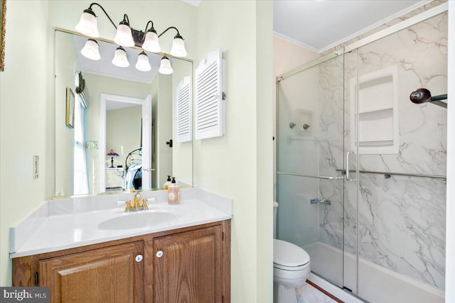 full bath with a marble finish shower, vanity, toilet, and crown molding