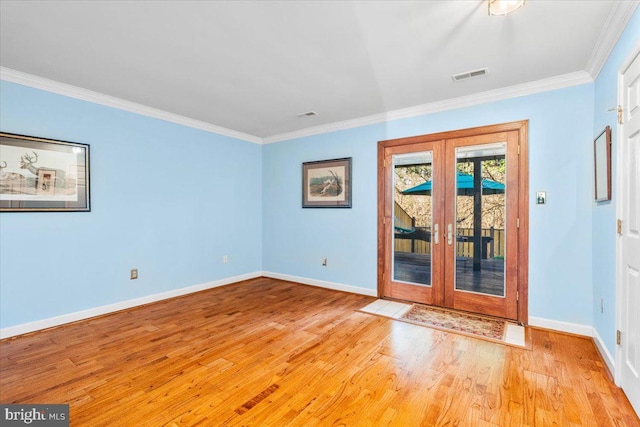 interior space featuring visible vents, baseboards, light wood-style floors, french doors, and crown molding