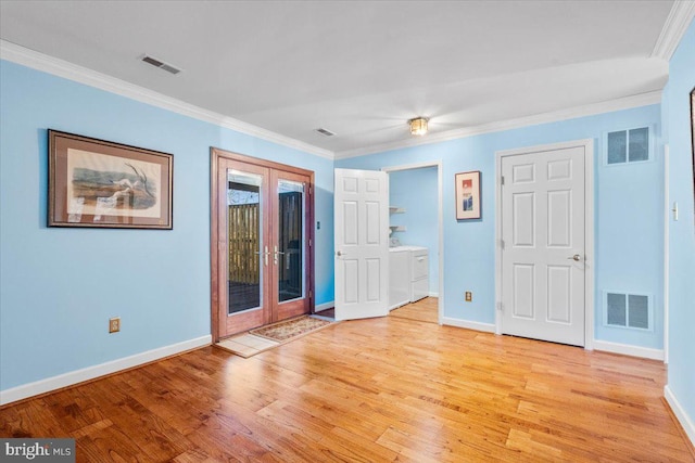 unfurnished bedroom featuring washer and clothes dryer, visible vents, and french doors