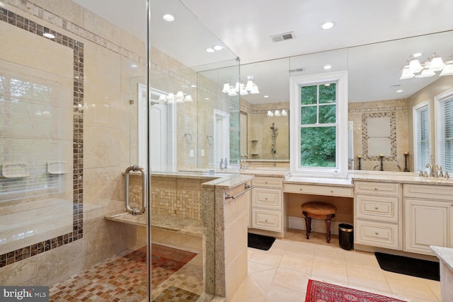 bathroom with tile patterned floors, visible vents, a tile shower, recessed lighting, and vanity