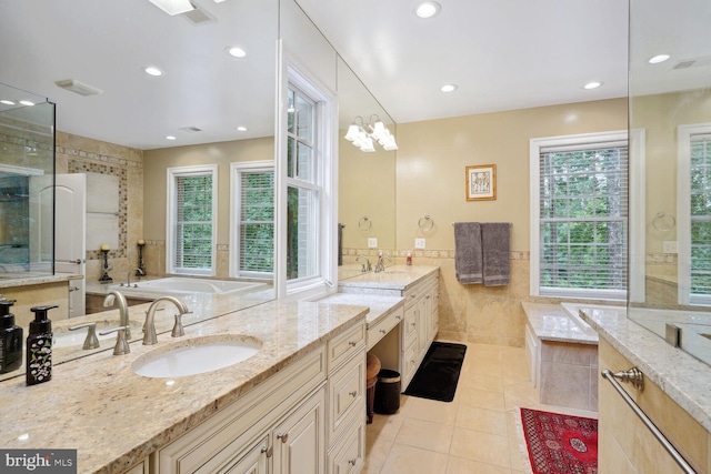 full bathroom featuring tile patterned flooring, vanity, a garden tub, recessed lighting, and tile walls