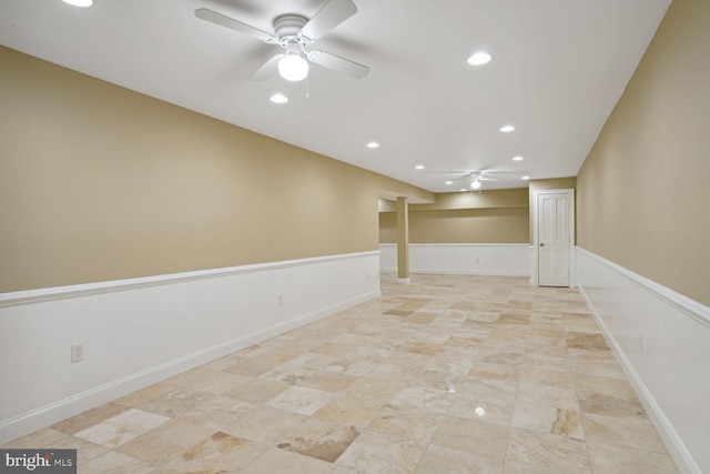 spare room with a wainscoted wall, recessed lighting, and a ceiling fan