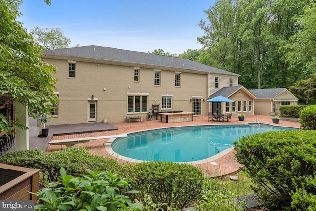 pool featuring a patio and a diving board