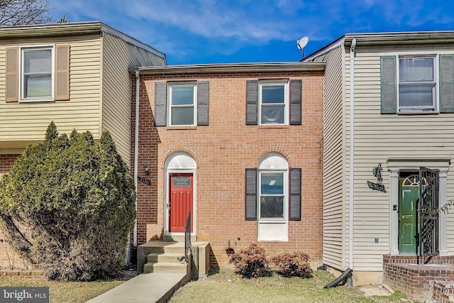 townhome / multi-family property with brick siding