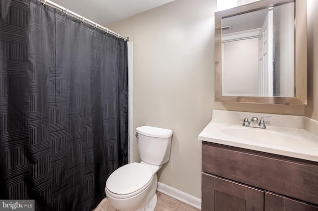 bathroom with baseboards, toilet, a shower with shower curtain, tile patterned floors, and vanity