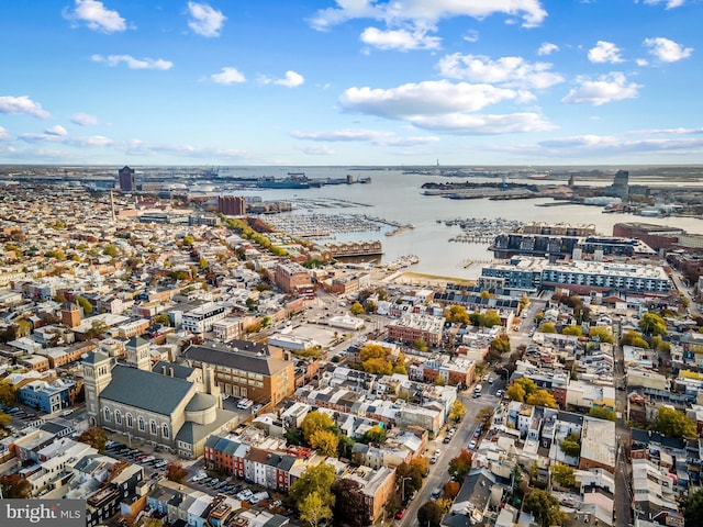 birds eye view of property featuring a view of city and a water view