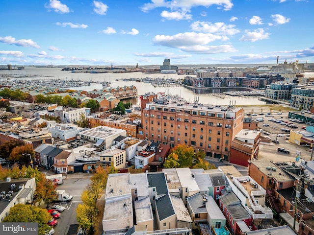 aerial view featuring a view of city and a water view