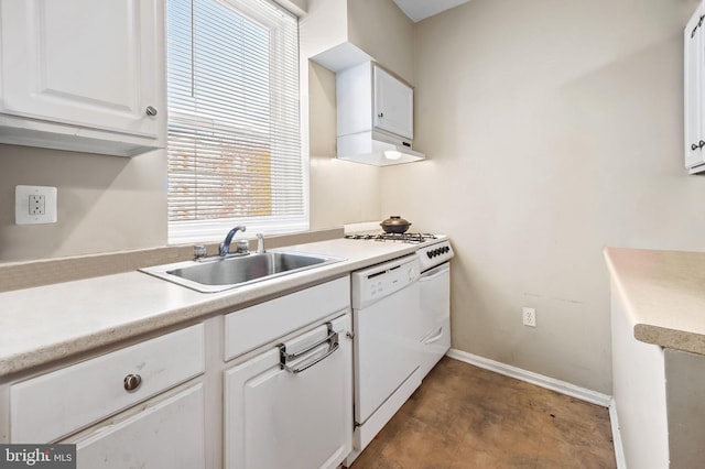 kitchen with white cabinetry, light countertops, white dishwasher, and a sink