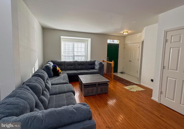 living room with baseboards and hardwood / wood-style floors