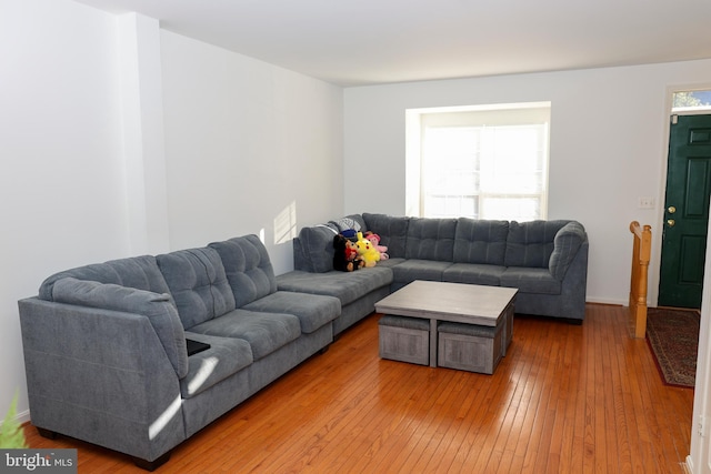 living area with hardwood / wood-style floors