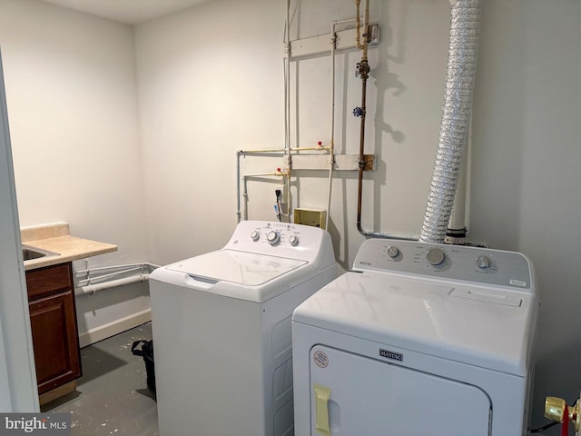 laundry room featuring washer and dryer and laundry area