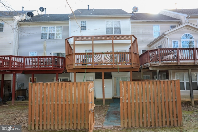 back of house featuring a deck