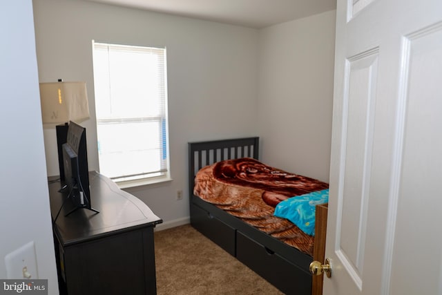 carpeted bedroom with baseboards