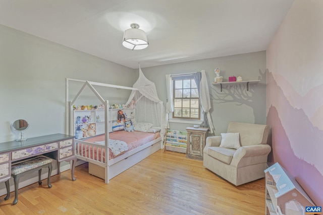 bedroom featuring wood finished floors