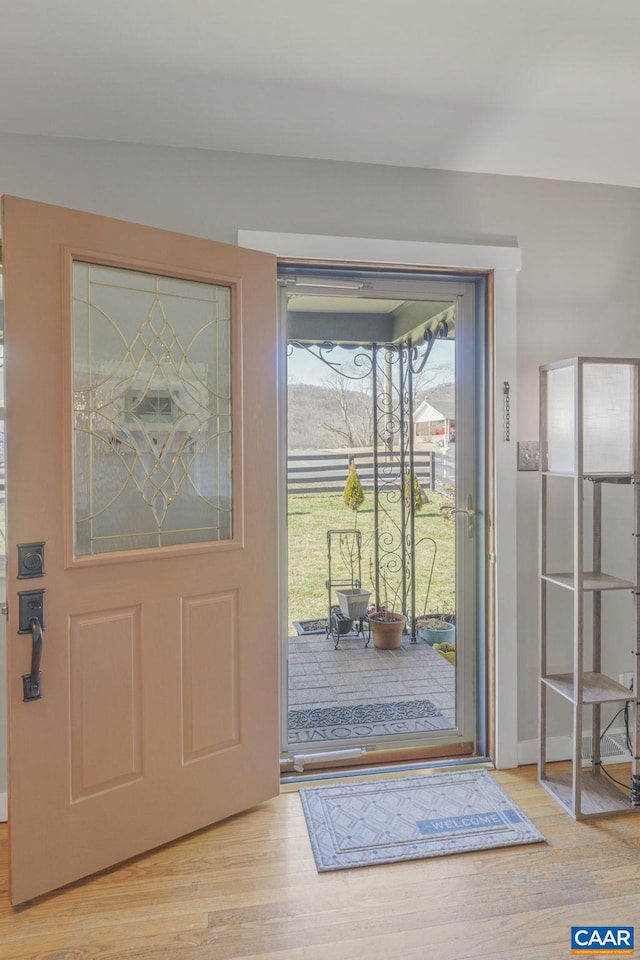 doorway featuring wood finished floors