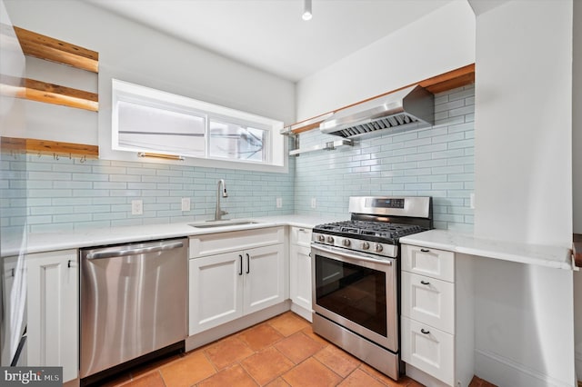 kitchen with backsplash, open shelves, stainless steel appliances, wall chimney exhaust hood, and a sink