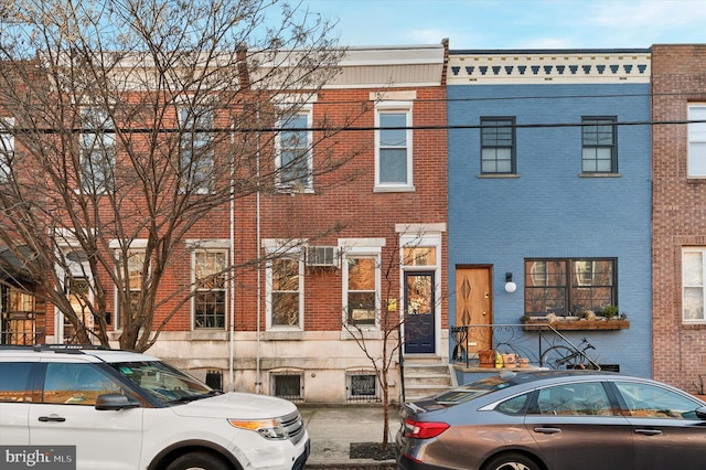 view of property featuring brick siding