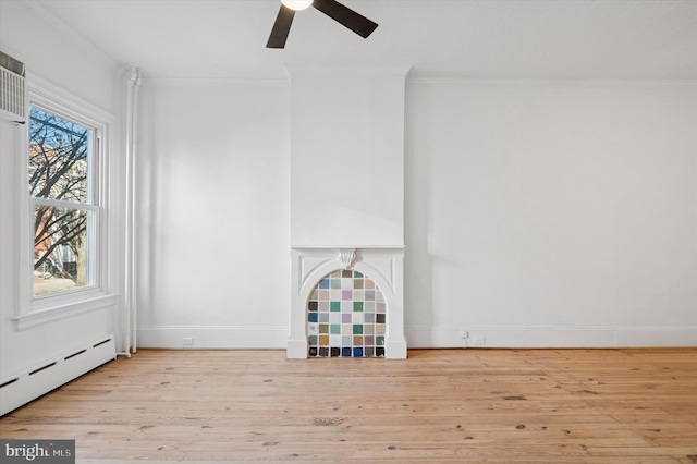 unfurnished living room with ceiling fan, baseboards, ornamental molding, baseboard heating, and wood finished floors