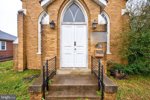 entrance to property with brick siding