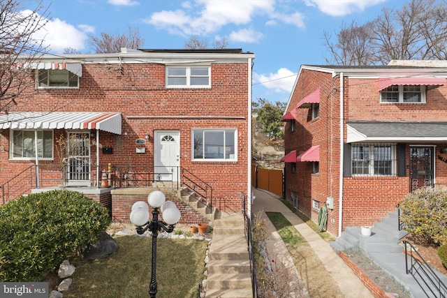 view of front of property featuring brick siding