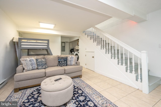 tiled living room featuring stairway and baseboards