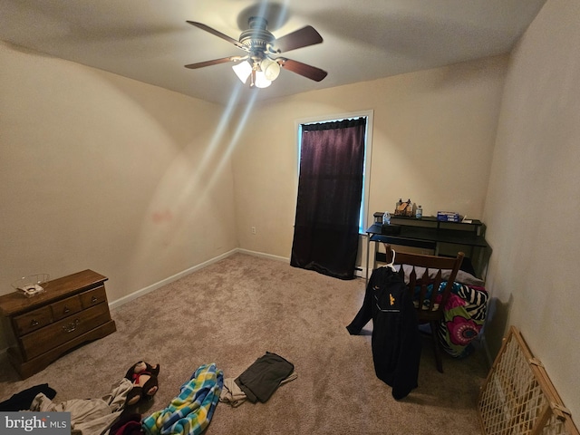 carpeted bedroom with baseboards and ceiling fan