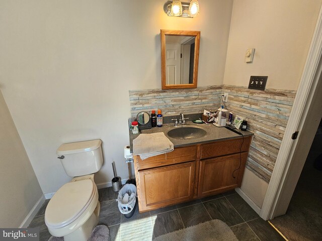 bathroom featuring toilet and vanity