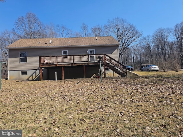 rear view of property with crawl space, stairway, and a wooden deck