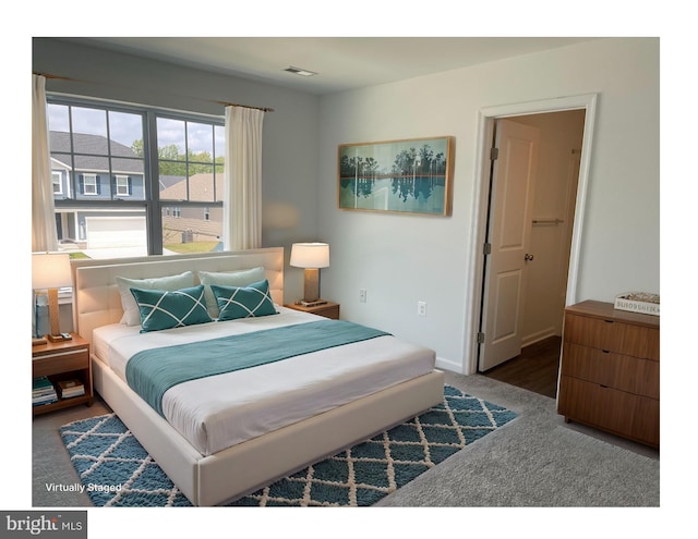 bedroom with baseboards and carpet flooring