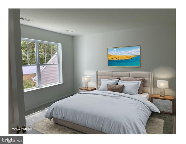 bedroom featuring baseboards and visible vents