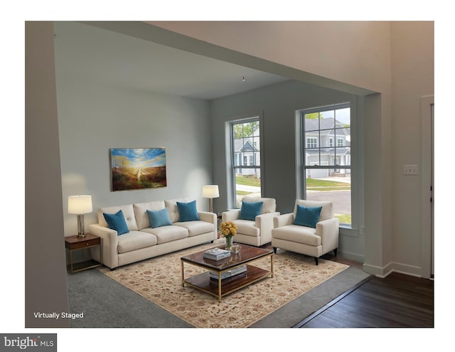 living area featuring wood finished floors and baseboards