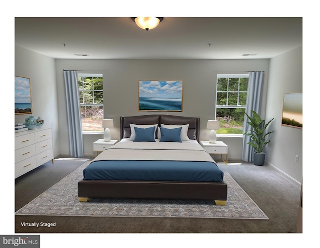 carpeted bedroom featuring visible vents, multiple windows, and baseboards