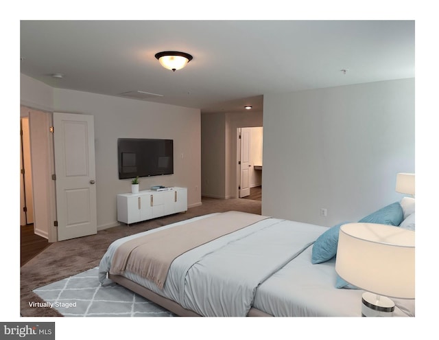 carpeted bedroom featuring baseboards