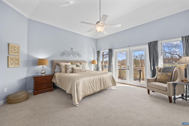 bedroom with carpet floors, multiple windows, ornamental molding, and access to outside