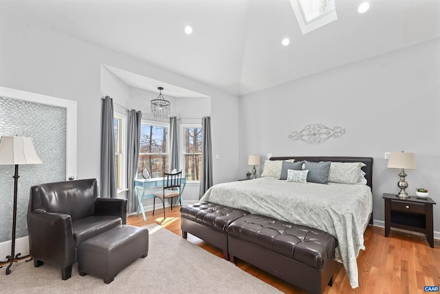 bedroom with a skylight, recessed lighting, light wood-type flooring, and baseboards