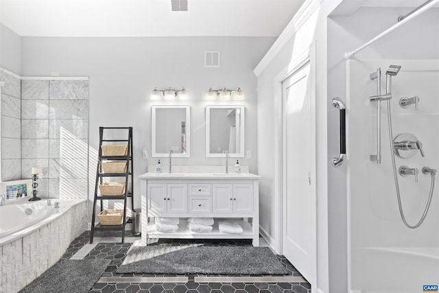 bathroom with visible vents, a shower, and a sink