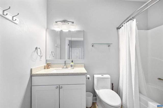 bathroom with toilet, shower / bath combo, and vanity