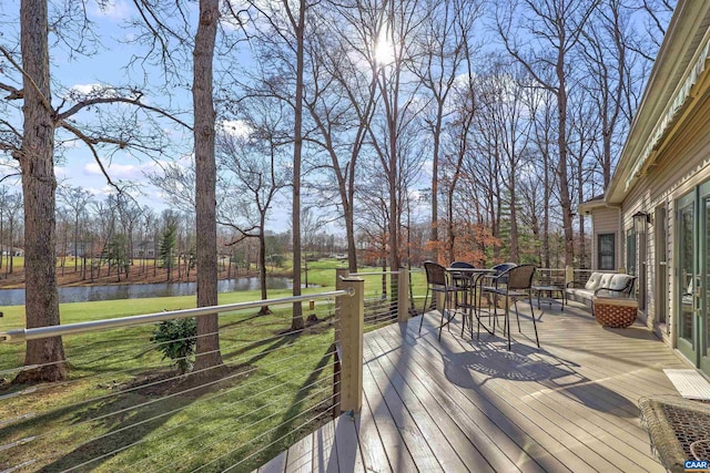 wooden deck featuring a water view