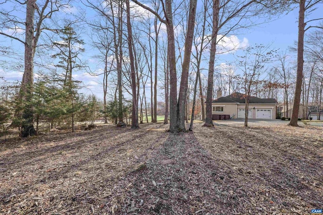 view of yard with a garage