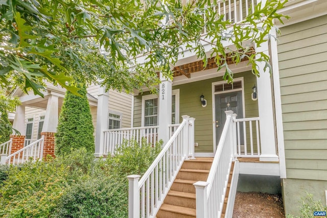 doorway to property featuring covered porch