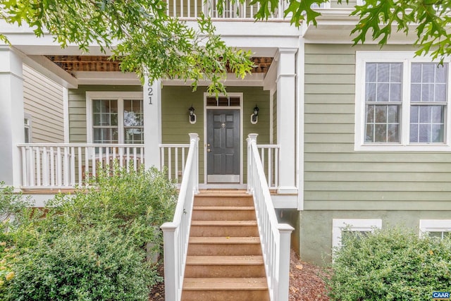 property entrance with covered porch