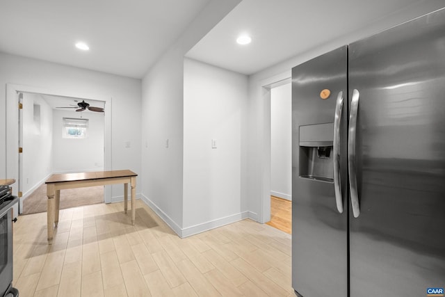 kitchen with recessed lighting, stainless steel fridge, light wood-style flooring, and baseboards