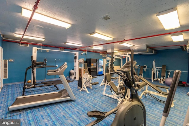 gym featuring visible vents and carpet