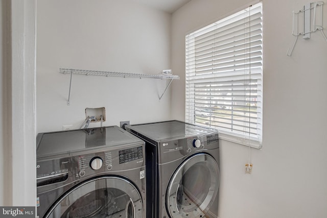 laundry room with plenty of natural light, independent washer and dryer, and laundry area